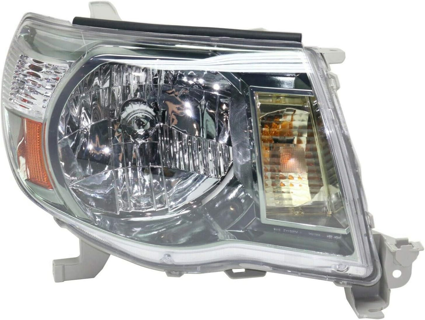 A Toyota Tacoma passenger side replacement headlight assembly with a clear lens and chrome-plated housing.