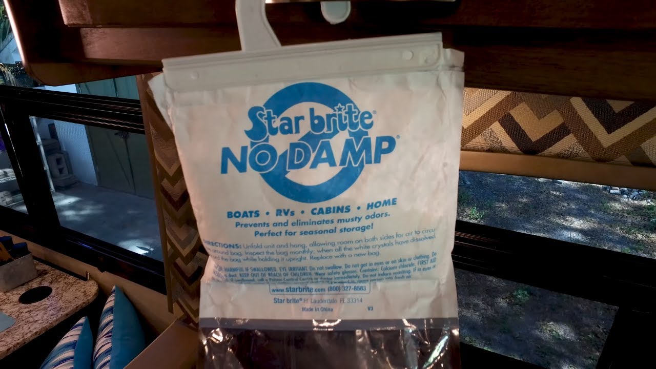 Star brite No Damp packaging hanging on a window frame