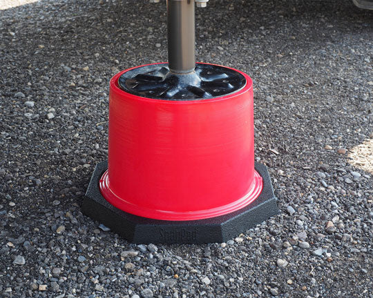 The Base by SnapPad under an RV trailer jack leveling block