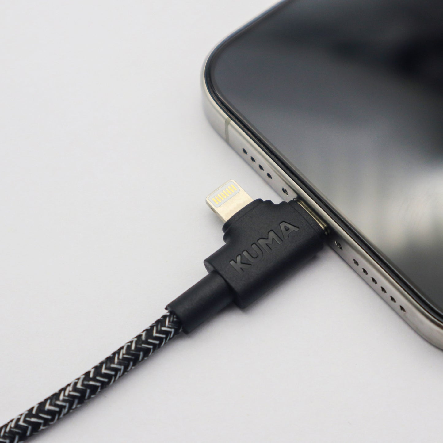 KUMA micro USB cable connected to a smartphone on a light gray background