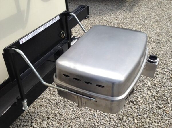 RV grill arm bracket with locking latch and mounting hardware