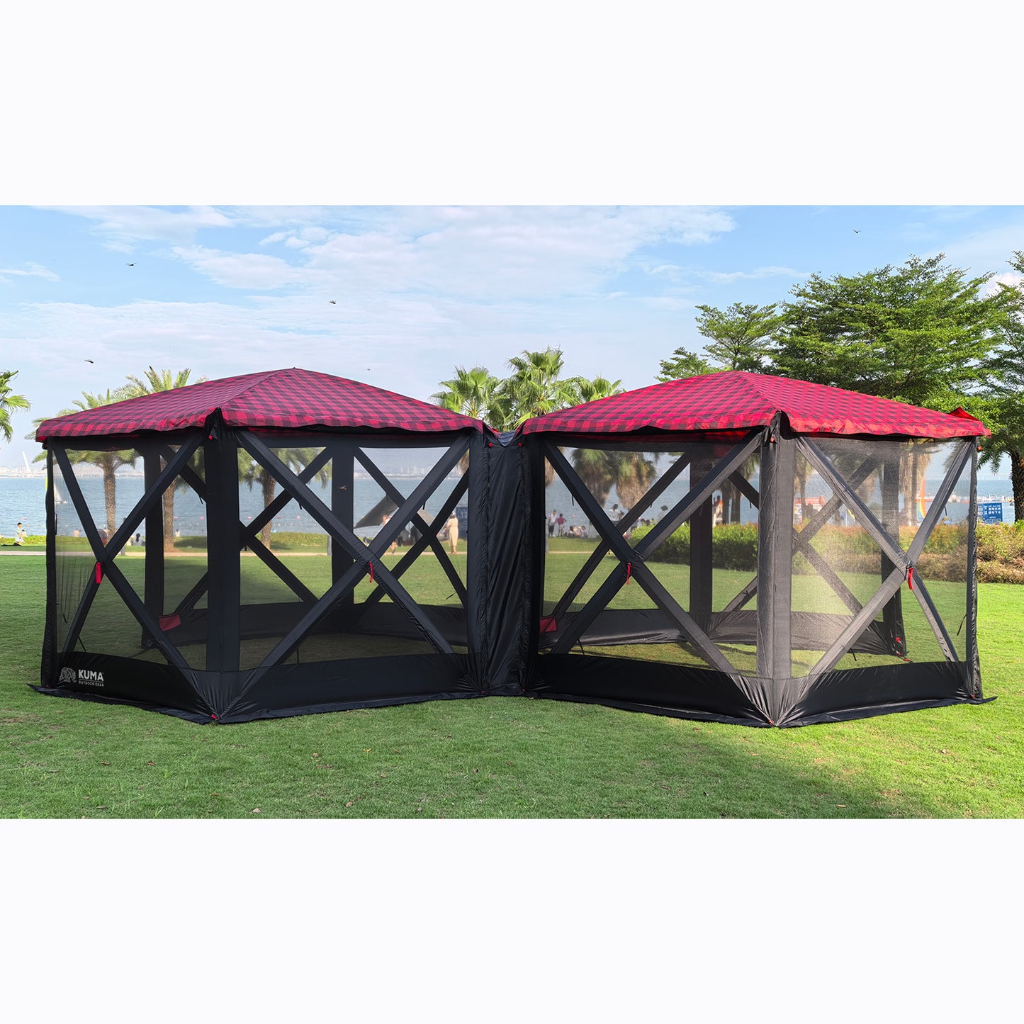Spacious and durable Kuma gazebo with roll-up walls, ideal for camping or backyard use.