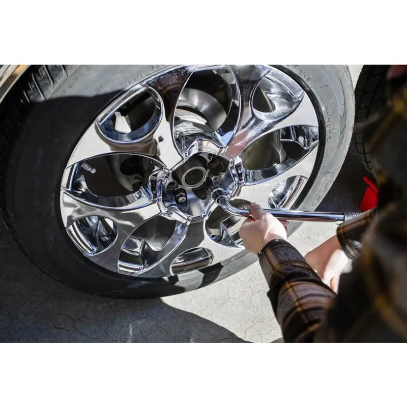 Extendable lug wrench in use with Andersen Mini Jack for easy tire change