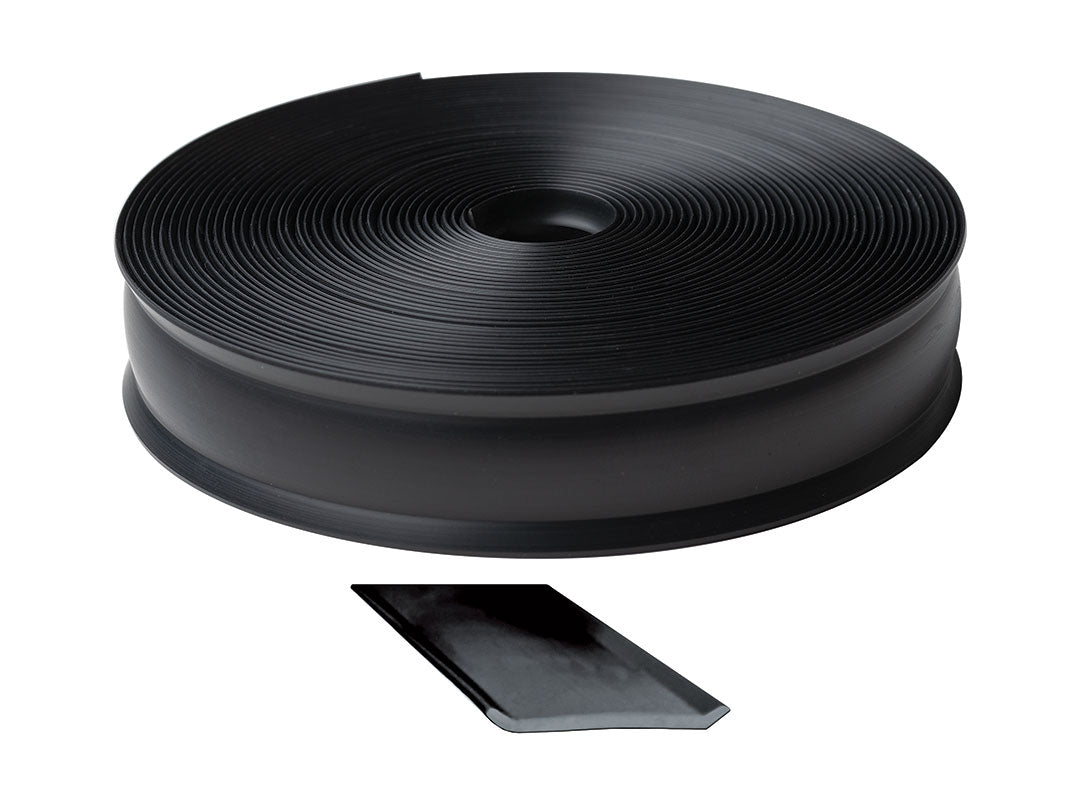 Roll of black trim molding with a sample piece on a white background