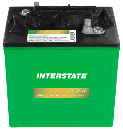Green Interstate battery with black top on a white background