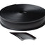 Roll of black trim molding insert with a small piece cut off on a white background