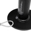 Close-up of a black metal stand with a cylindrical component and a wire rope attached.