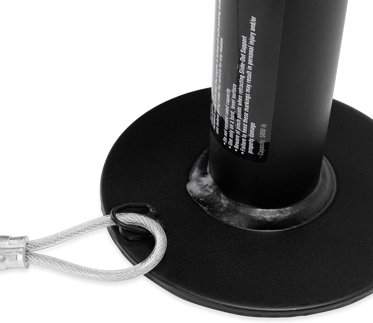 Close-up of a black metal stand with a cylindrical component and a wire rope attached.