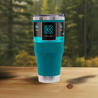 Double-wall insulated Kailani tumbler on a wooden table outdoors