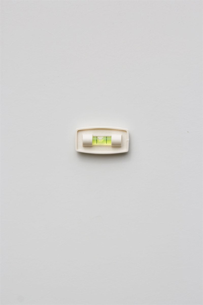 Small silver level on a light gray background