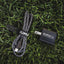 Kuma outdoor gear charging cable and adapter on grass