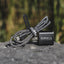 Kuma outdoor gear device with braided cable on a natural background
