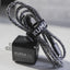 Kuma outdoor gear charging cable and adapter on a neutral background