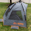 Kuma Keep It Cool shelter secured with stakes outdoors
