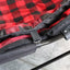 Kuma Lazy Bear dog blanket layered on dog bed for warmth
