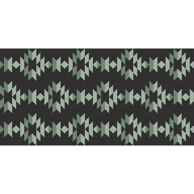 Kuma Monterrey Boho Outdoor Mat set up at a scenic campsite with stakes secured.