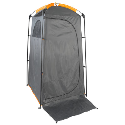 Side angle of the tent with guy lines anchored to the ground.