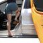 Rightline Gear Moki Ascent door latch step in use for reaching vehicle roof
