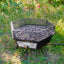 Outdoor campfire experience with Kuma Off-Grid Hex Fire Bowl providing warmth and ambiance.