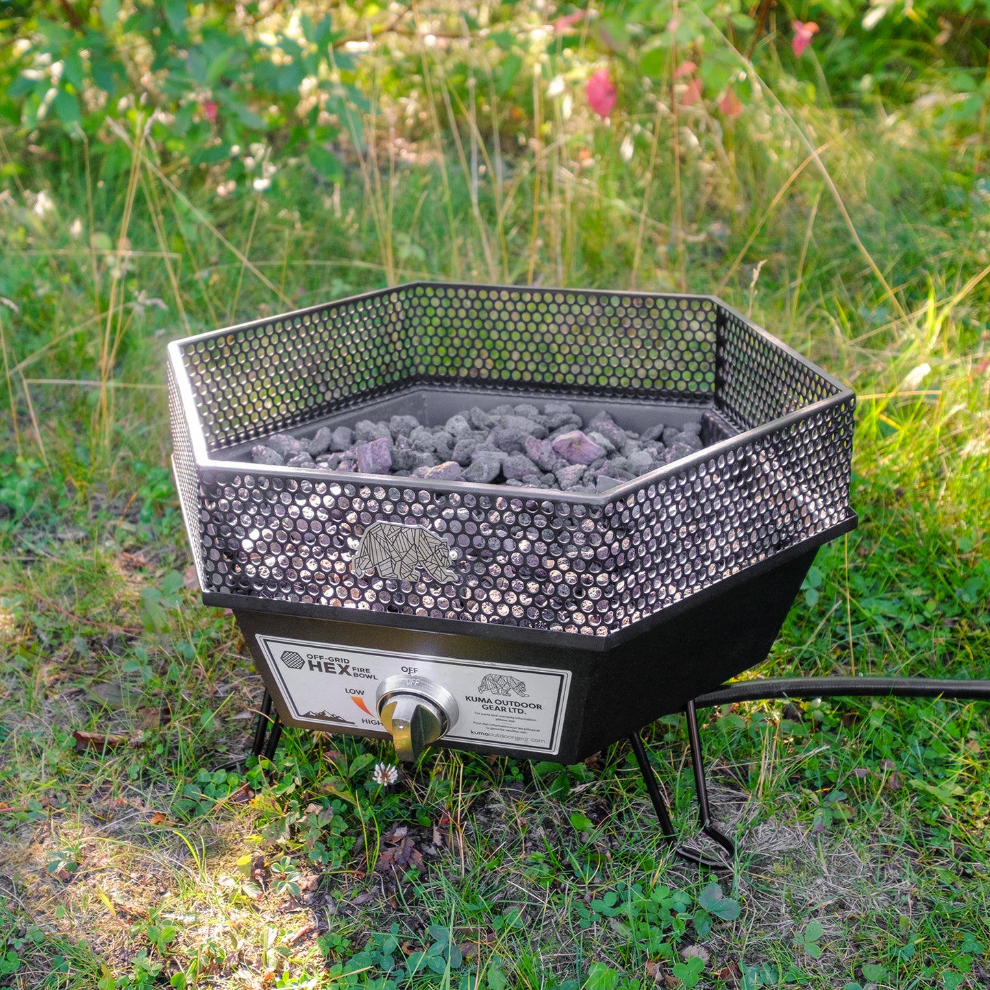 Outdoor campfire experience with Kuma Off-Grid Hex Fire Bowl providing warmth and ambiance.