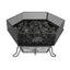 Hexagonal metal fire pit with lava rocks inside on a white background
