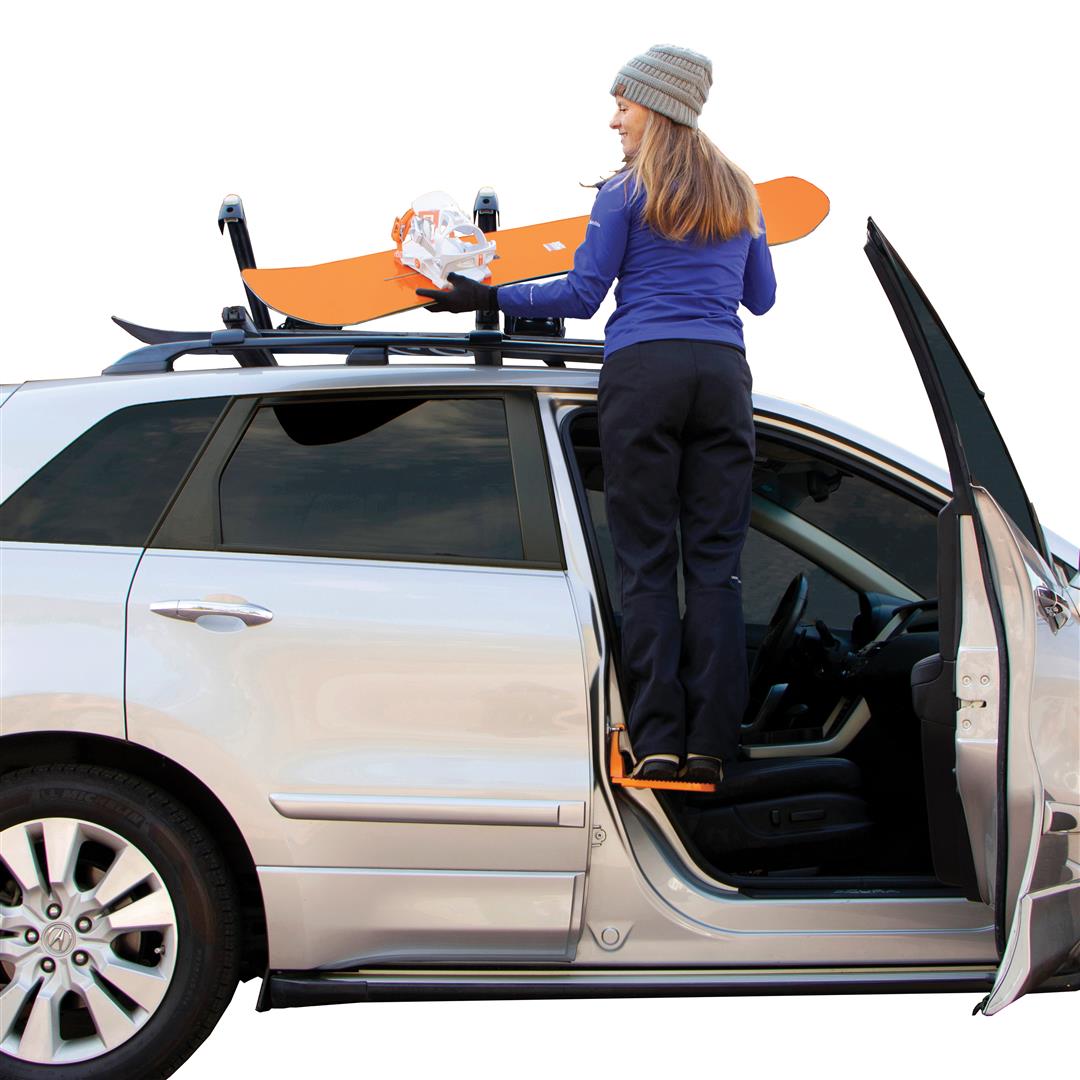 Rightline Gear Moki Ascent door latch step in use for reaching vehicle roof