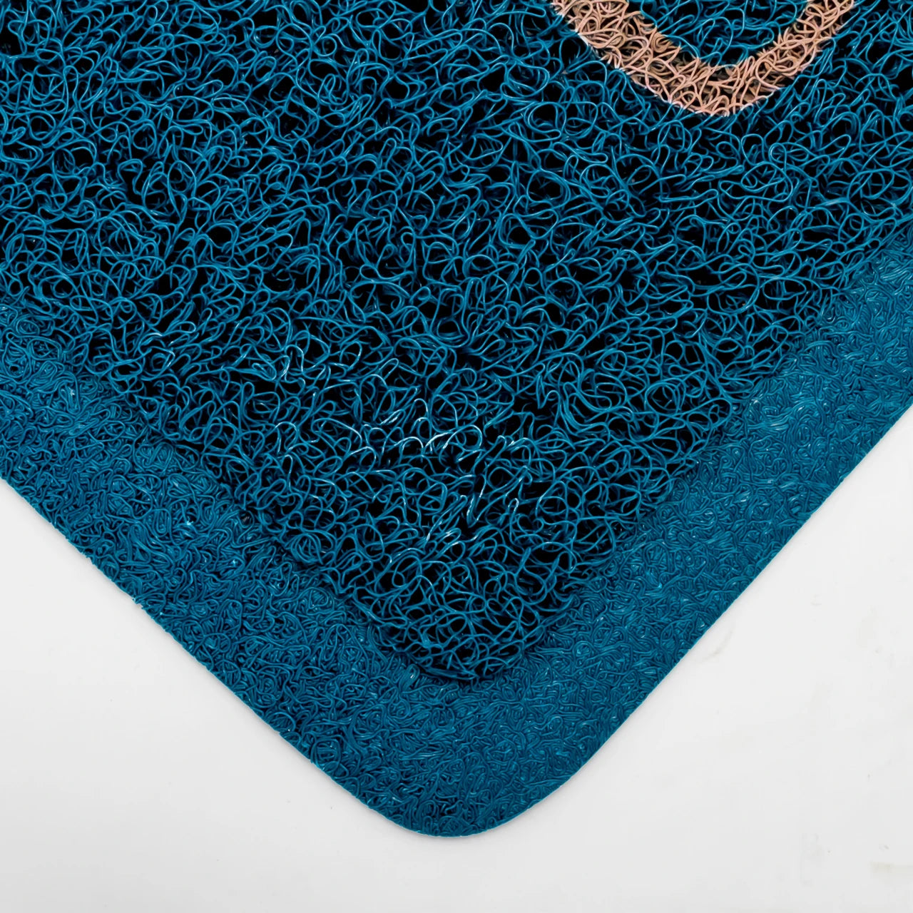 A close-up of a dark teal textured mat with a thick solid border and a small tan accent along one edge, shown on a white background.
