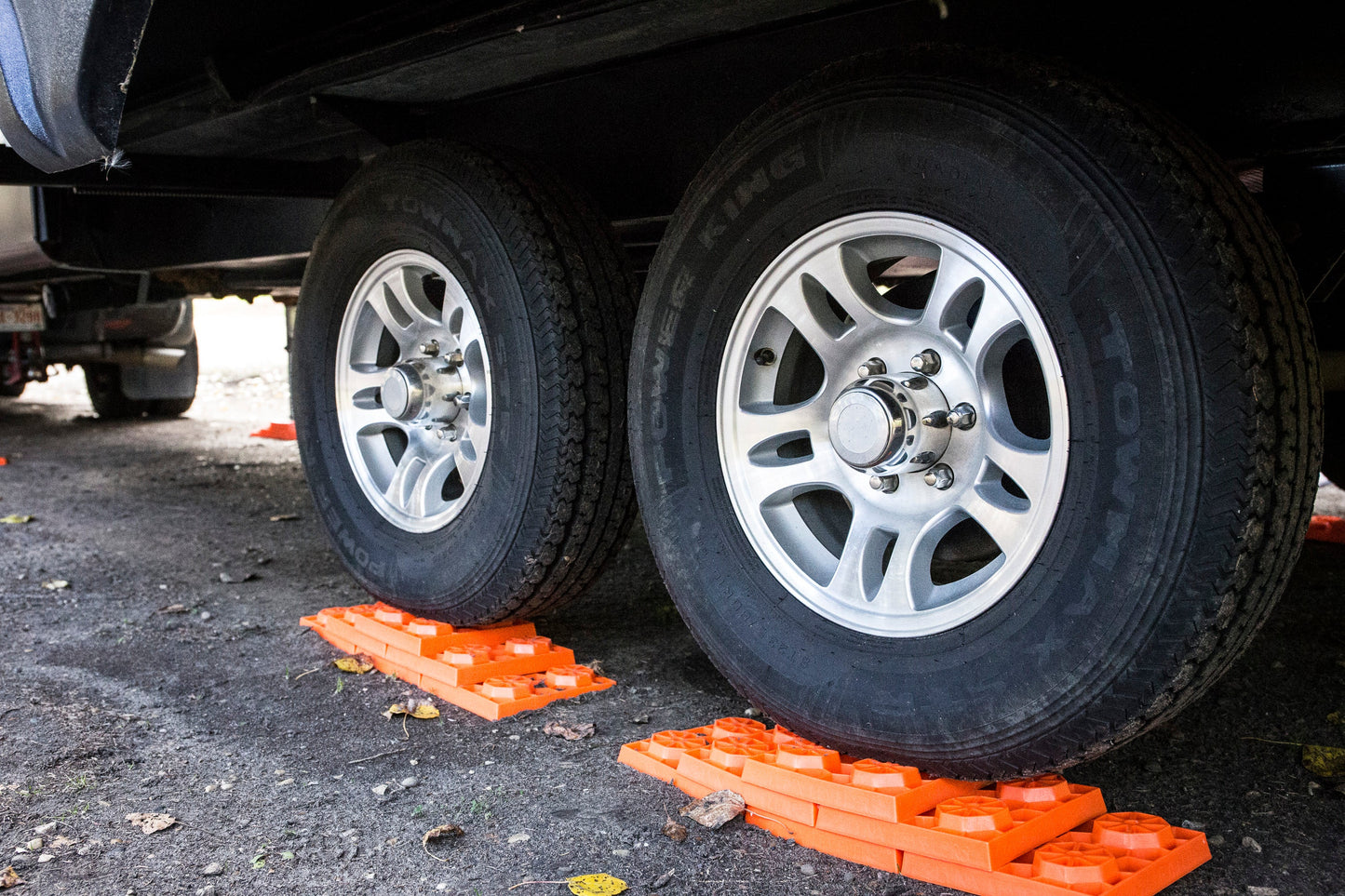 Stacked Tri-Lynx leveling blocks under RV tire