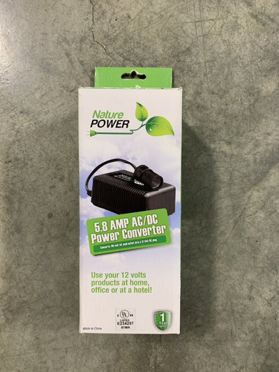 A black 6.5 AMP AC/DC converter in packaging, with the Nature Power brand prominently displayed.