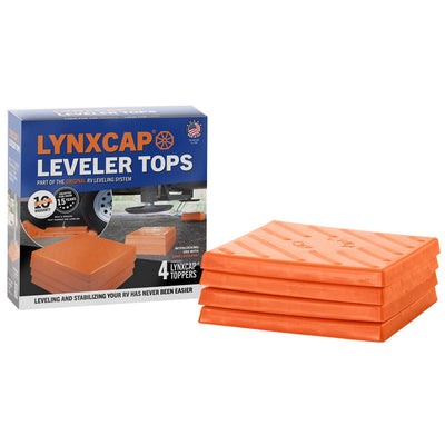 A set of four orange LynxCap leveling blocks placed on top of a box with product information.