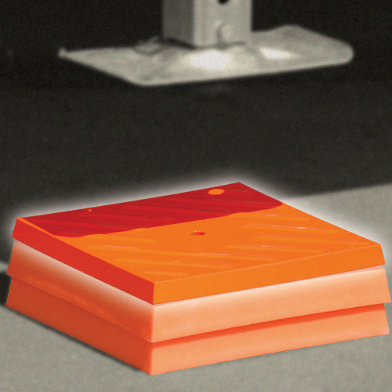 Orange Tri-Lynx RV leveling caps